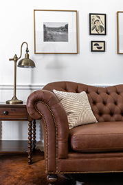 Watson sofa in Brisa Distressed Bridle faux leather at <a href=https://holbrooke.com>The Holbrooke Hotel</a>. Photo by Kat Alves.
