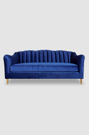 Carla sofa in Thompson Danube stain-proof blue velvet with brass legs