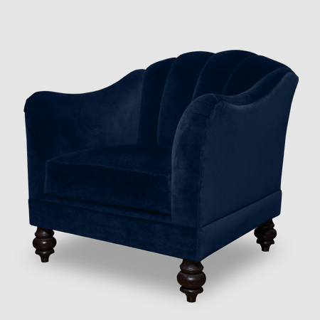 Blue velvet armchair with white piping
