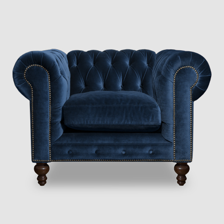 Tufted lapis blue velvet scroll arm sofa