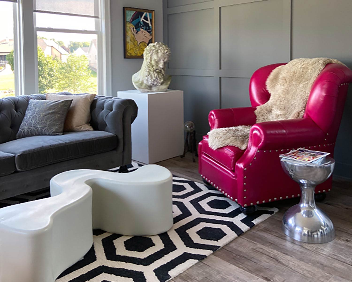 Eugene recliner in Absolute Magenta leather and Higgins Chesterfield in Como Grey Cloud