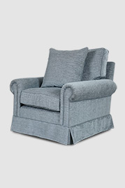 Didi armchair with skirt in Stanton Breeze stain-proof blue fabric with throw pillow