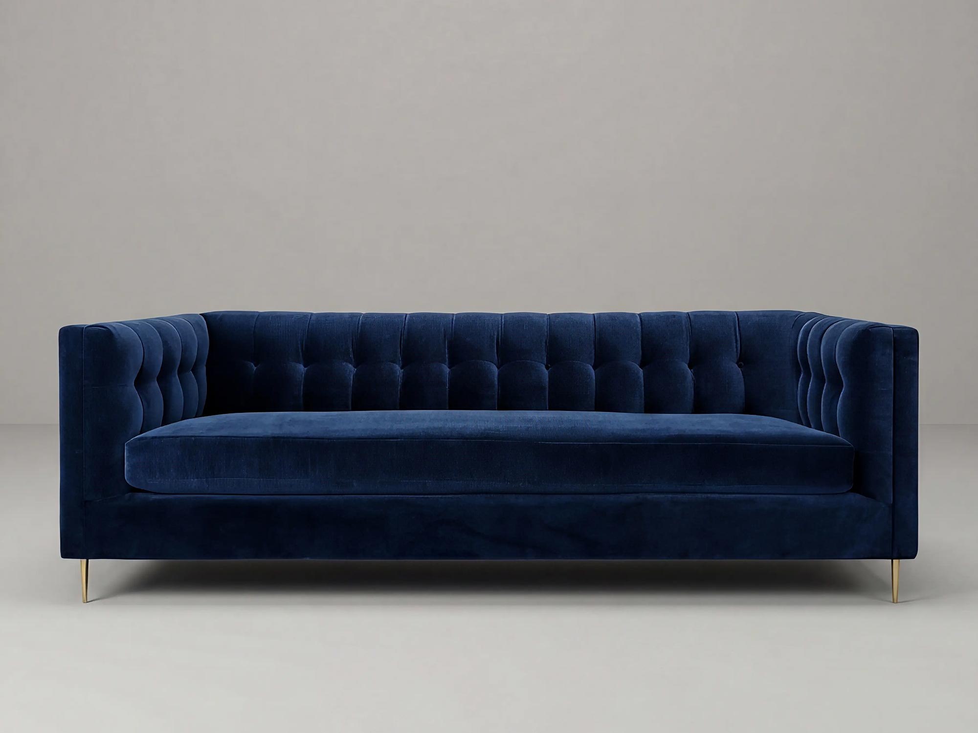 Atticus sofa in Como Indigo blue velvet with brass legs