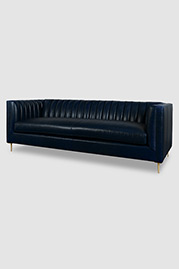 Harley channel-tufted modern sofa in Florence Mezza Luna blue Crypton-protected leather, bench cushion, and brass legs