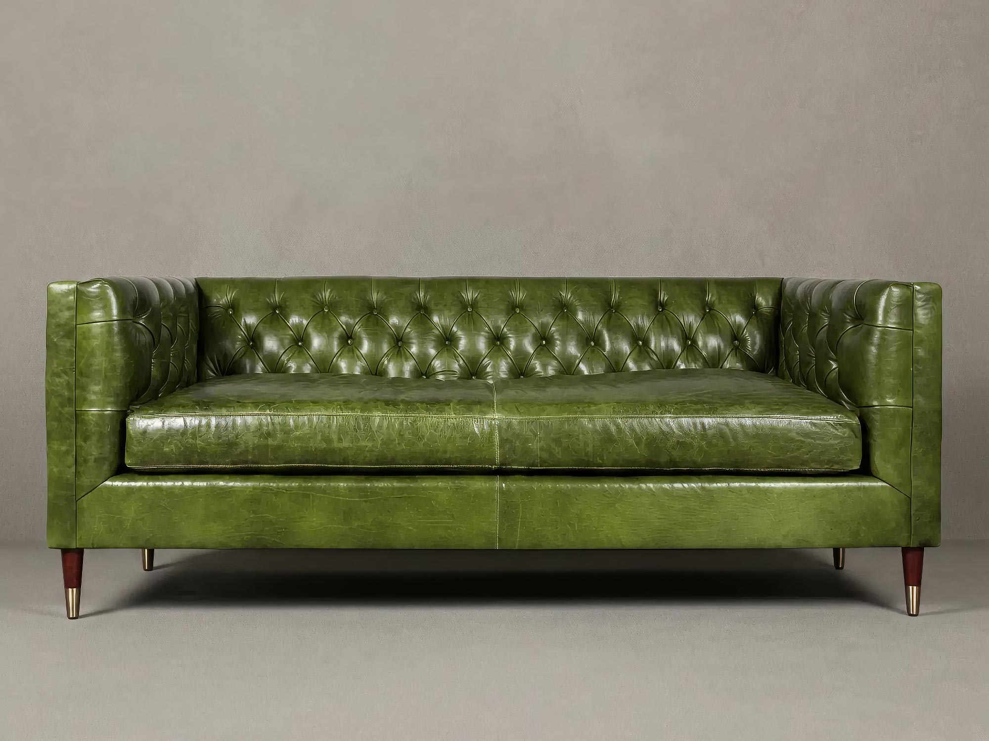 79 Dot sofa in Mont Blanc Evergreen leather with wood legs with brass sabots