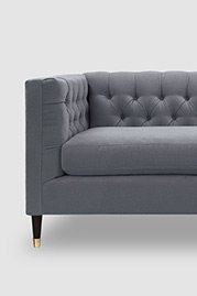 Dot loveseat in Crosby Mist stain-resistant grey velvet with brass-capped wood legs