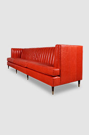 114 Erica sofa in Athene Rosso with brass-tipped legs