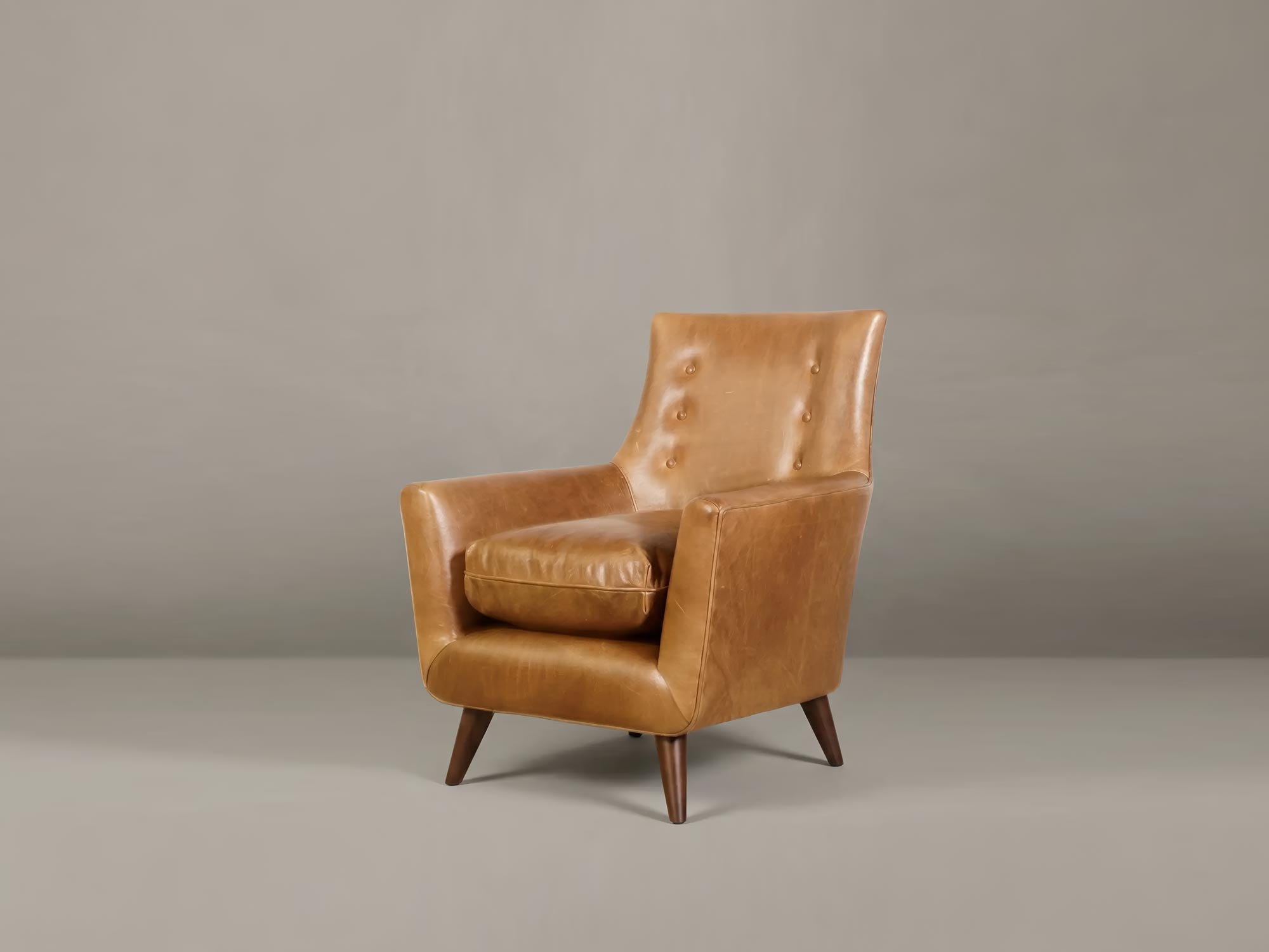 Gogo armchair in brown leather