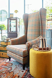 Inspector armchair in Heritage Newbury Walnut with contrasting orange welt
