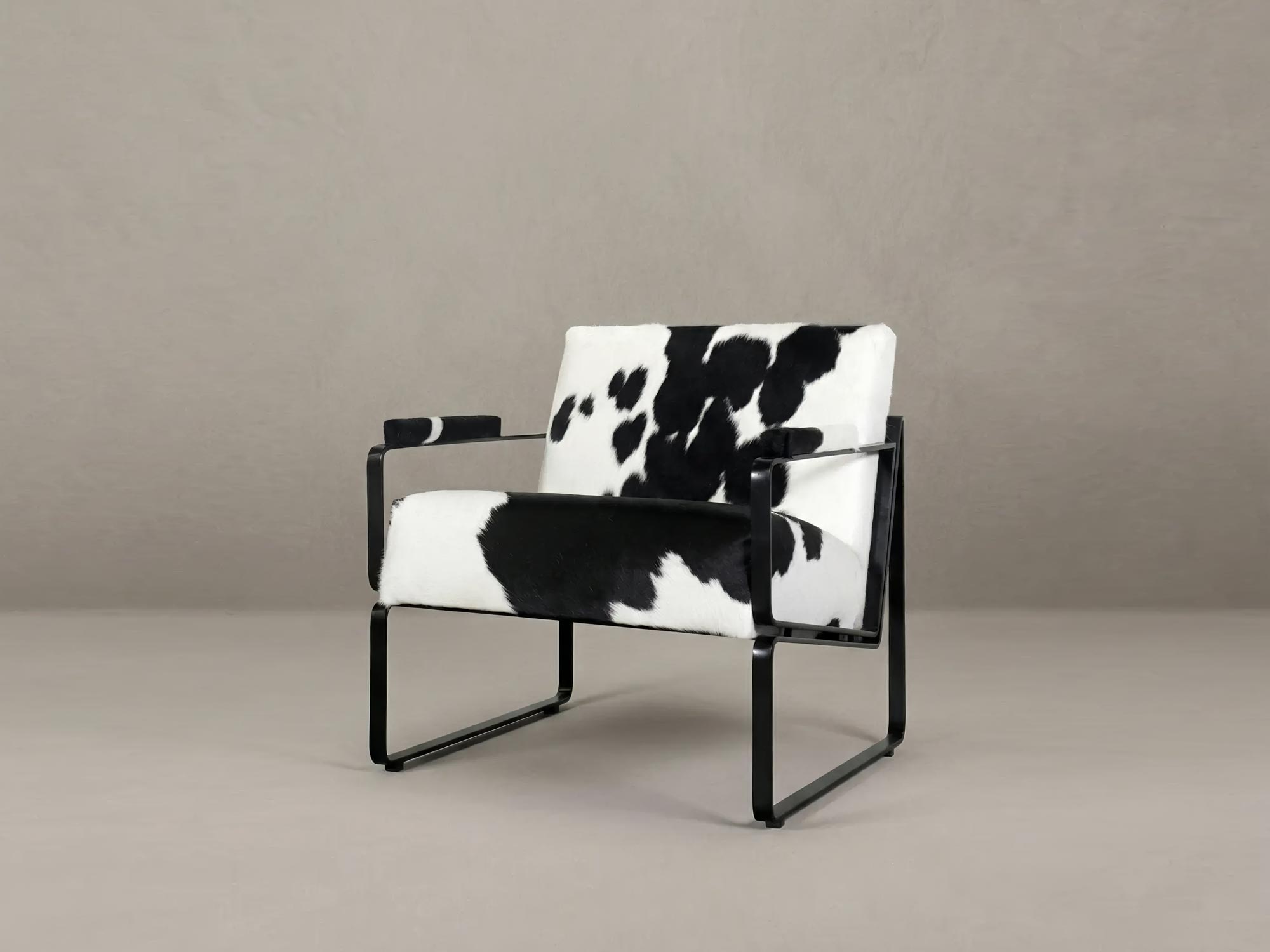 Weldon armchair in Harrison Wool Tweed and black metal finish with cushion back and seat