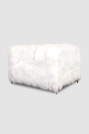 Ski Bum armchair in Cashmere Tibetan sheepskin with brass stiletto legs