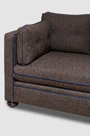 Greta sectional in Curly Q Chocolate performance fabric with blue leather welt