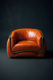 Buttercup armchair in Bellissimo Cachi orange leather with Bellissimo Sepreverde green welt
