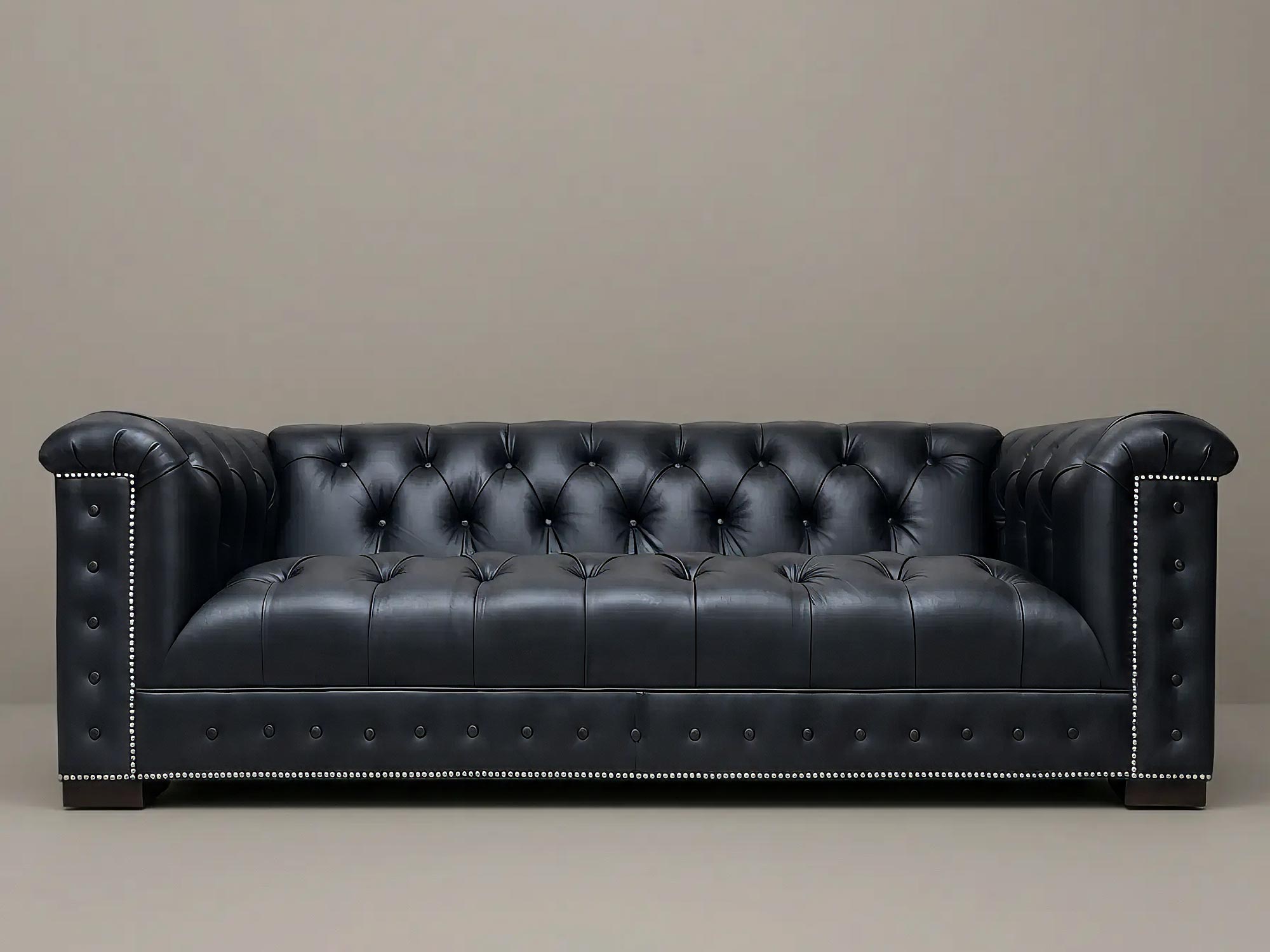 88 Mr. Butler sofa in Vintage Nights Peak black leather with nail head trim