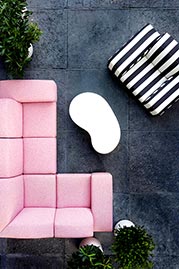 Amalfi outdoor sectional in Barbados Pink performance fabric and armchair in Sunbrella Cabana Classic performance fabric