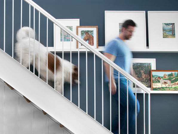 Chris and Buck walk down the stairs.