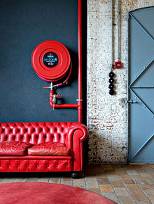 Red leather Chesterfield sofa.