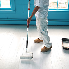 Porch paint covers the stained and beat-up floors.