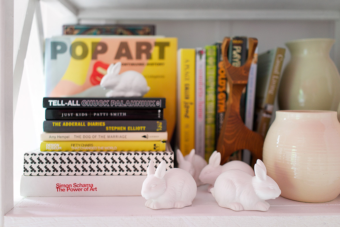 We decorated the bookshelf with favorite novels, art books, and pottery.