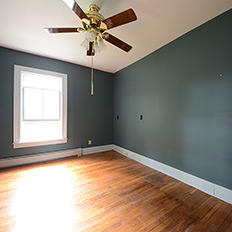 Before: Blotchy wood floor and confusing colors.