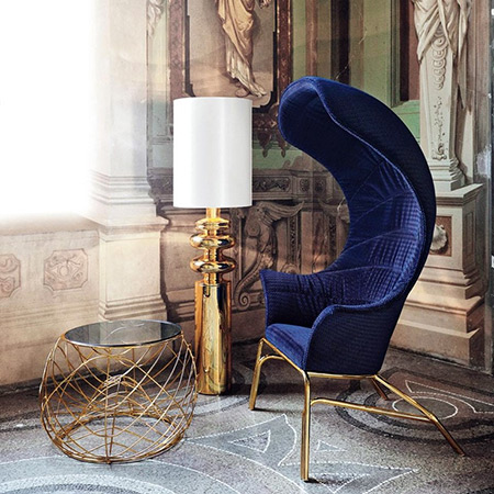 Blue velvet campaign chair