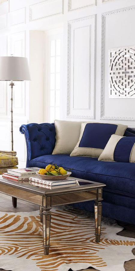 Tufted blue velvet scroll arm sofa