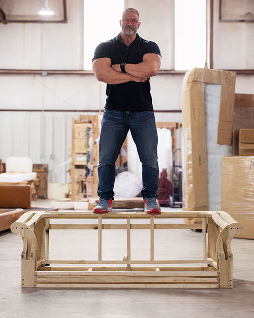 Chris Stout-Hazard standing on lumber frame