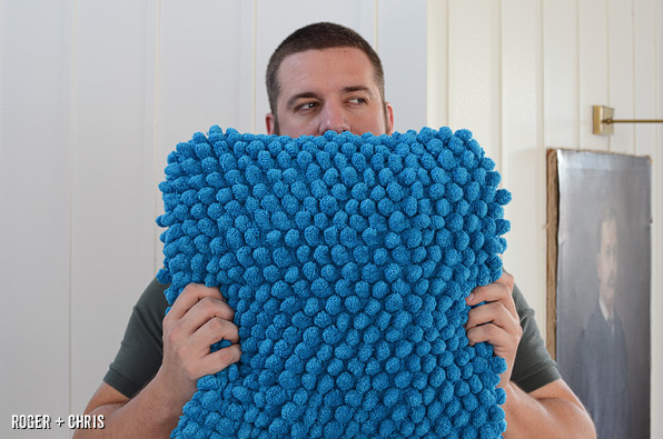Chris shows off the completed bath mat pillow.