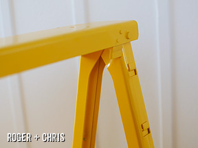 All-metal construction and bright yellow paint echos more expensive modern tables.
