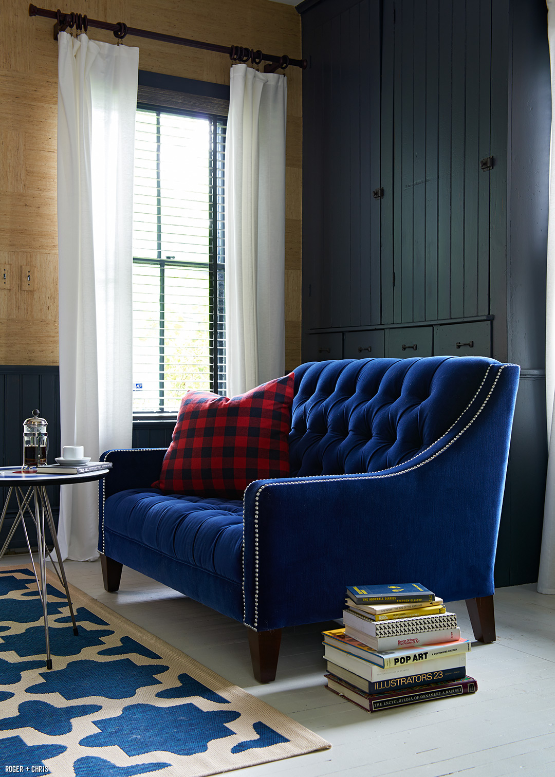 Our tufted Lincoln love seat in blue velvet. Photo by Alec Hemer.