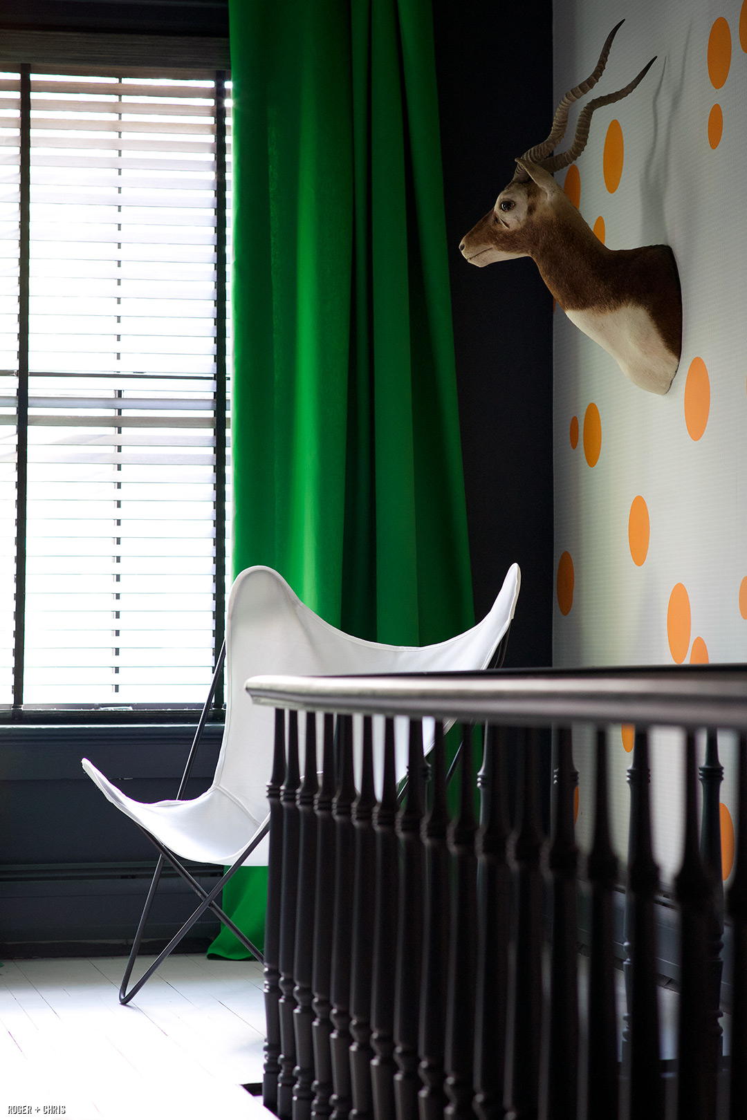 Green drapes and wallpaper.