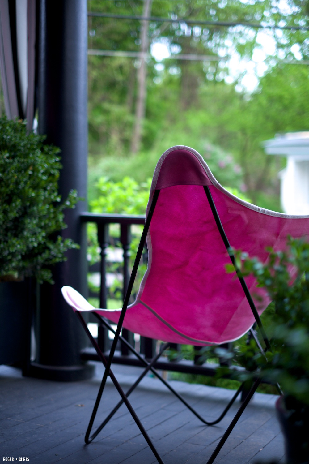 Butterfly chair on the front porch. We dyed the fabric to match our color theme.